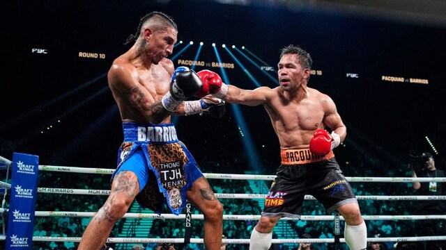 Mario Barrios, left, fights Manny Pacquiao in a welterweight title boxing match Saturday, July 19, 2025, in Las Vegas. (AP Photo/John Locher)
