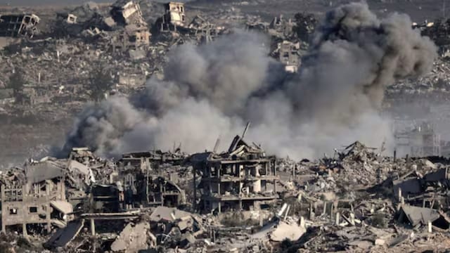 This picture taken from Israel's border with the Gaza Strip shows smoke billowing over destroyed buildings during an Israeli strike on the besieged Palestinian territory. (File/AFP)