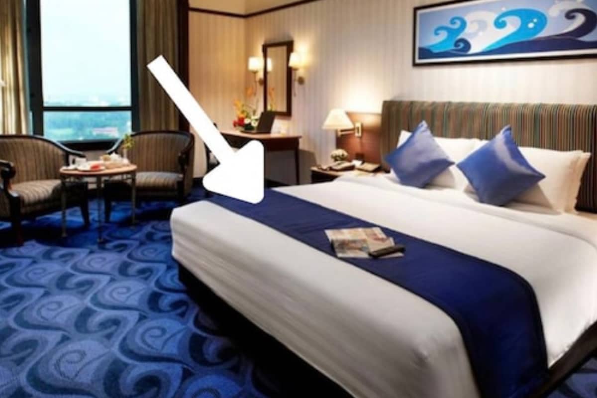 Why Do Hotels Put A Cloth Runner At The Foot Of The Bed? It's More Than Just Decoration
