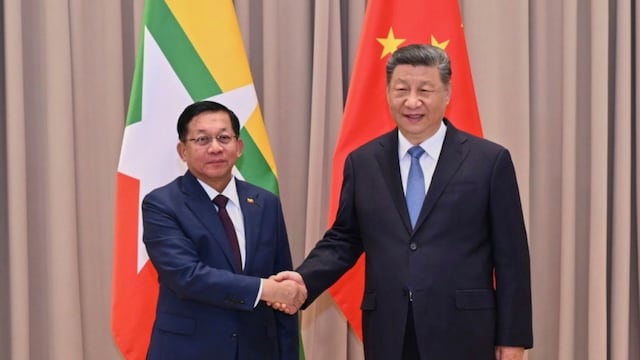 In this photo provided by Myanmar Military True News Information Team on May 9, 2025, Myanmar military chief Senior Gen. Min Aung Hlaing, left, shakes hands with Chinese President Xi Jinping, right, during their meeting in Moscow, Russia.