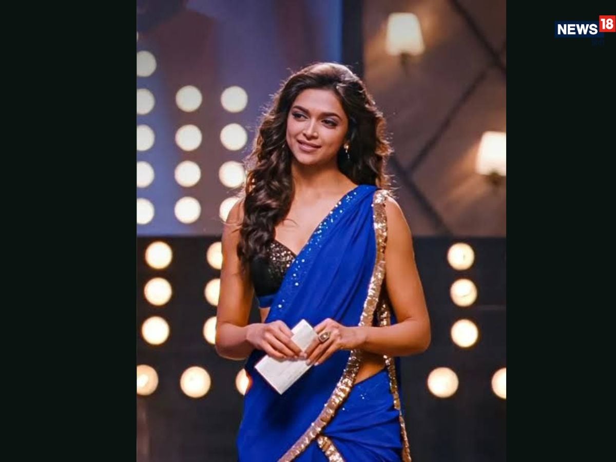 Deepika Padukone’s striking blue saree with a black shimmer blouse in Yeh Jawaani Hai Deewani became one of the most searched Bollywood looks. Her glamorous transformation in the ‘Badtameez Dil’ song turned the saree into a symbol of youthful style and cemented her image as a fashion icon. (News18 Hindi) Deepika Padukone’s striking blue saree with a black shimmer blouse in Yeh Jawaani Hai Deewani became one of the most searched Bollywood looks. Her glamorous transformation in the ‘Badtameez Dil’ song turned the saree into a symbol of youthful style and cemented her image as a fashion icon. (News18 Hindi)