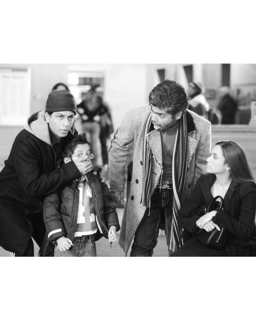 Another photo captures Shah Rukh Khan playfully closing the mouth of his on-screen son, while Karan looks on in surprise. Another photo captures Shah Rukh Khan playfully closing the mouth of his on-screen son, while Karan looks on in surprise.