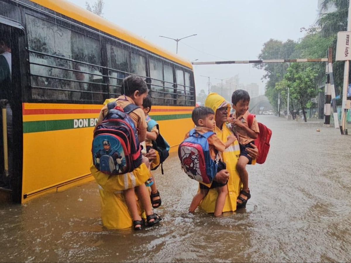 Children Among 8 Rescued After School Bus Stranded On Flooded Mumbai Road | Video | India News - News18