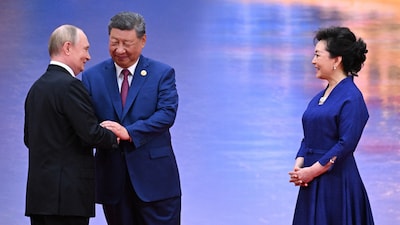 Russia's President Vladimir Putin, Chinese President Xi Jinping and his wife Peng Liyuan attend a welcoming ceremony of the SCO (AFP)