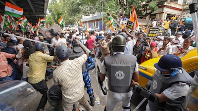  BJP members and security personnel clash during a protest organised to mark the completion of one year of the rape and murder of a trainee doctor at RG Kar hospital (PTI)