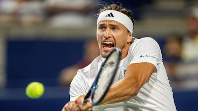 Alexander Zverev of Germany hits a backhand return to Francisco Cerundolo of Argentina during their match at the National Bank Open in Toronto, Saturday, Aug. 2, 2025. (Frank Gunn/The Canadian Press via AP)
