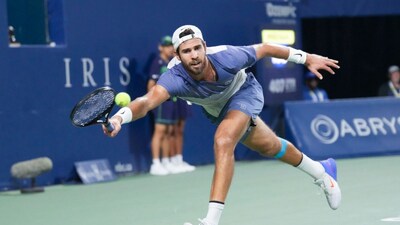 Karen Khachanov of Russia hits a return to Alexander Zverev of Germany during semifinal tennis action at the National Bank Open in Toronto on Wednesday, August 6, 2025. (Chris Young/The Canadian Press via AP)
