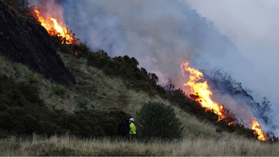 A view of a fire on Arthur's Seat in Holyrood Park, in Edinburgh, Scotland, Sunday, Aug. 10, 2025. (Jane Barlow/PA via AP)