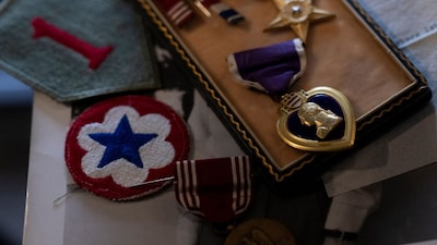 Medals, including a Purple Heart and Silver Star, that belonged to combat photographer Richard Taylor are seen on May 10, 2024, in College Park, Maryland. (AFP)