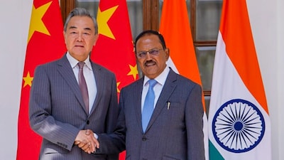 NSA Ajit Doval with Chinese Foreign Minister Wang Yi during a meeting in New Delhi. (PTI photo)