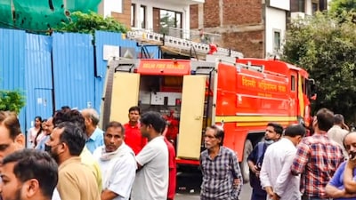 Firemen outside the Kosmos Hospital where a fire broke out in the server room, at Anand Vihar area, in New Delhi, Saturday. (PTI photo)