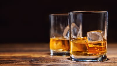 A half-filled liquor bottle and four glasses were seized from the hotel room, which had been rented to celebrate Friendship Day. (Representative/Shutterstock)
