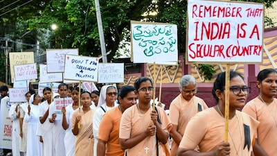 Members of Christian community take part in a protest rally against the arrest of two Kerala nuns on allegations of forcible conversion and trafficking in Chhattisgarh, in Hyderabad, on Thursday. (PTI)