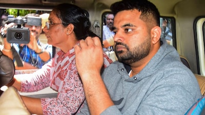 Prajwal Revanna being taken to a hospital for medical examination under tight security, in Bengaluru. (PTI)