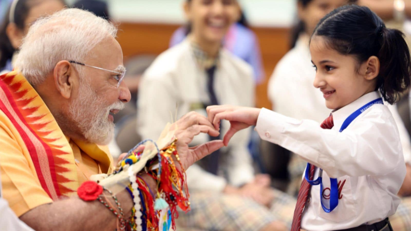 PM Modi celebrated Raksha Bandhan on Saturday with school students at his official residence in New Delhi. PM Modi celebrated Raksha Bandhan on Saturday with school students at his official residence in New Delhi.