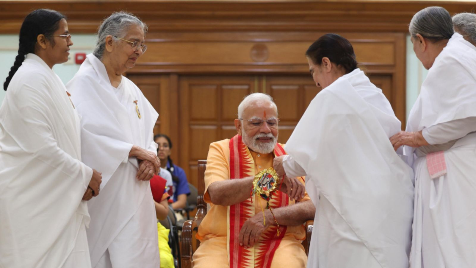 Members of the spiritual organisation Brahma Kumari tying rakhis on his wrist. (Credits: X) Members of the spiritual organisation Brahma Kumari tying rakhis on his wrist. (Credits: X)