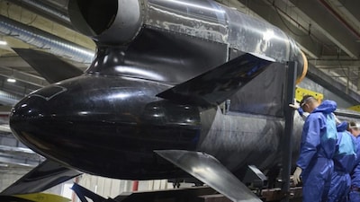 Workers inspecting a Flamingo cruise missile at Fire Point's secret factory (AP Photo)