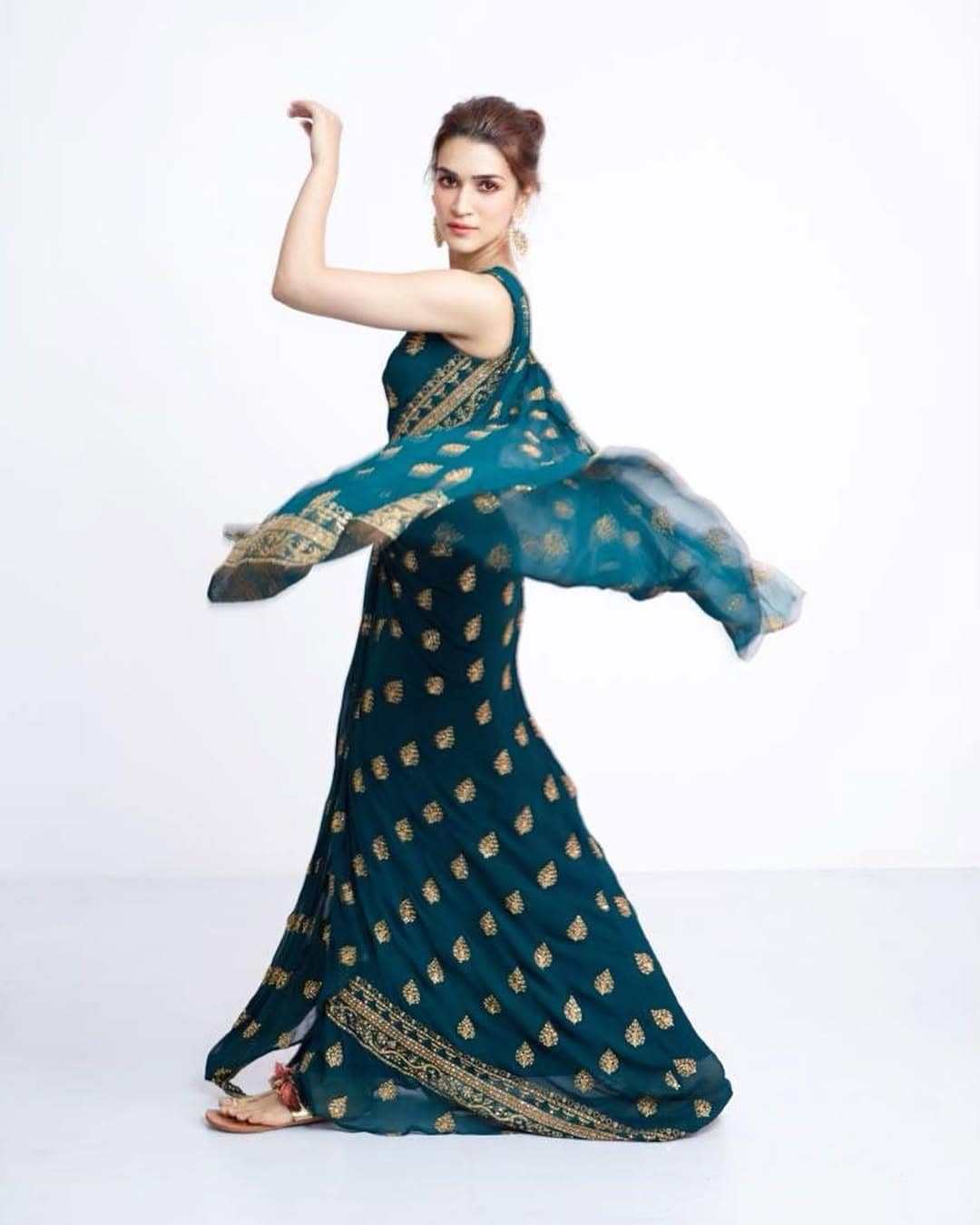Kriti Sanon: Slay the fusion game with a saree-inspired outfit, just like Kriti Sanon—bold, elegant, and fashion-forward. (Image: Instagram) Kriti Sanon: Slay the fusion game with a saree-inspired outfit, just like Kriti Sanon—bold, elegant, and fashion-forward. (Image: Instagram)