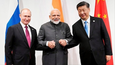 Prime Minister Narendra Modi with Russian President Vladimir Putin (L) and Chinese President Xi Jinping (File photo/AP)