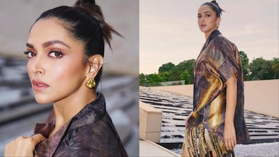 Deepika Padukone wore an oversized silk shirt and a golden mini skirt with dramatic fringes.