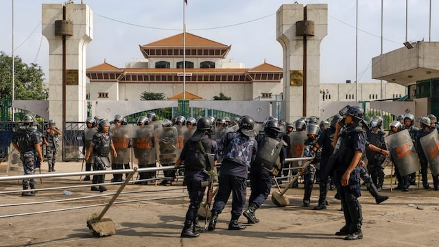 Security personnel pull a barricade outside Nepal's Parliament amid massive anti-government protests in Kathmandu. (PTI photo)