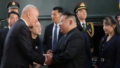 Kim Jong Un in Beijing with Kim Ju Ae.