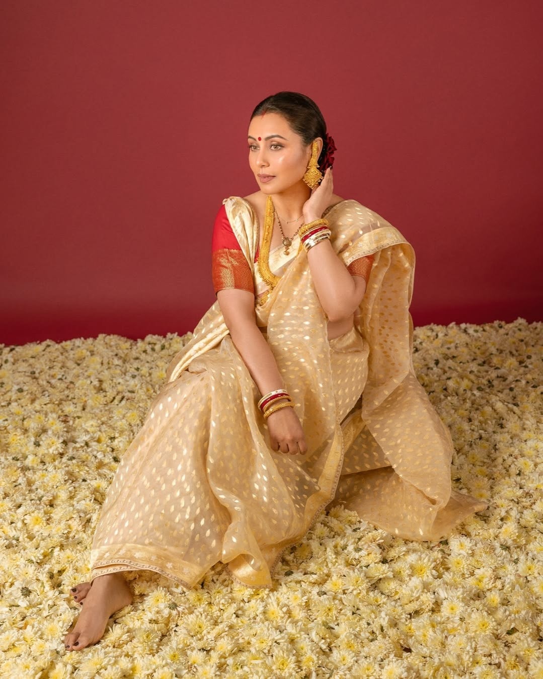 Tussar Silk Saree: Take style cues from Rani Mukherji and ace the tussar silk saree look, paired with a red 3/4th sleeve blouse and traditional gold jewellery for timeless elegance. (Image: Instagram) Tussar Silk Saree: Take style cues from Rani Mukherji and ace the tussar silk saree look, paired with a red 3/4th sleeve blouse and traditional gold jewellery for timeless elegance. (Image: Instagram)