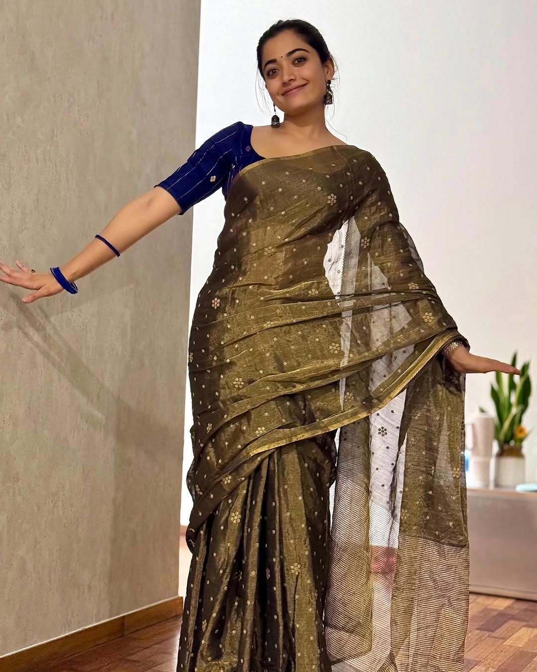 If being understated is your thing, this mehndi green silk saree worn by Rashmika will hit the right chords.