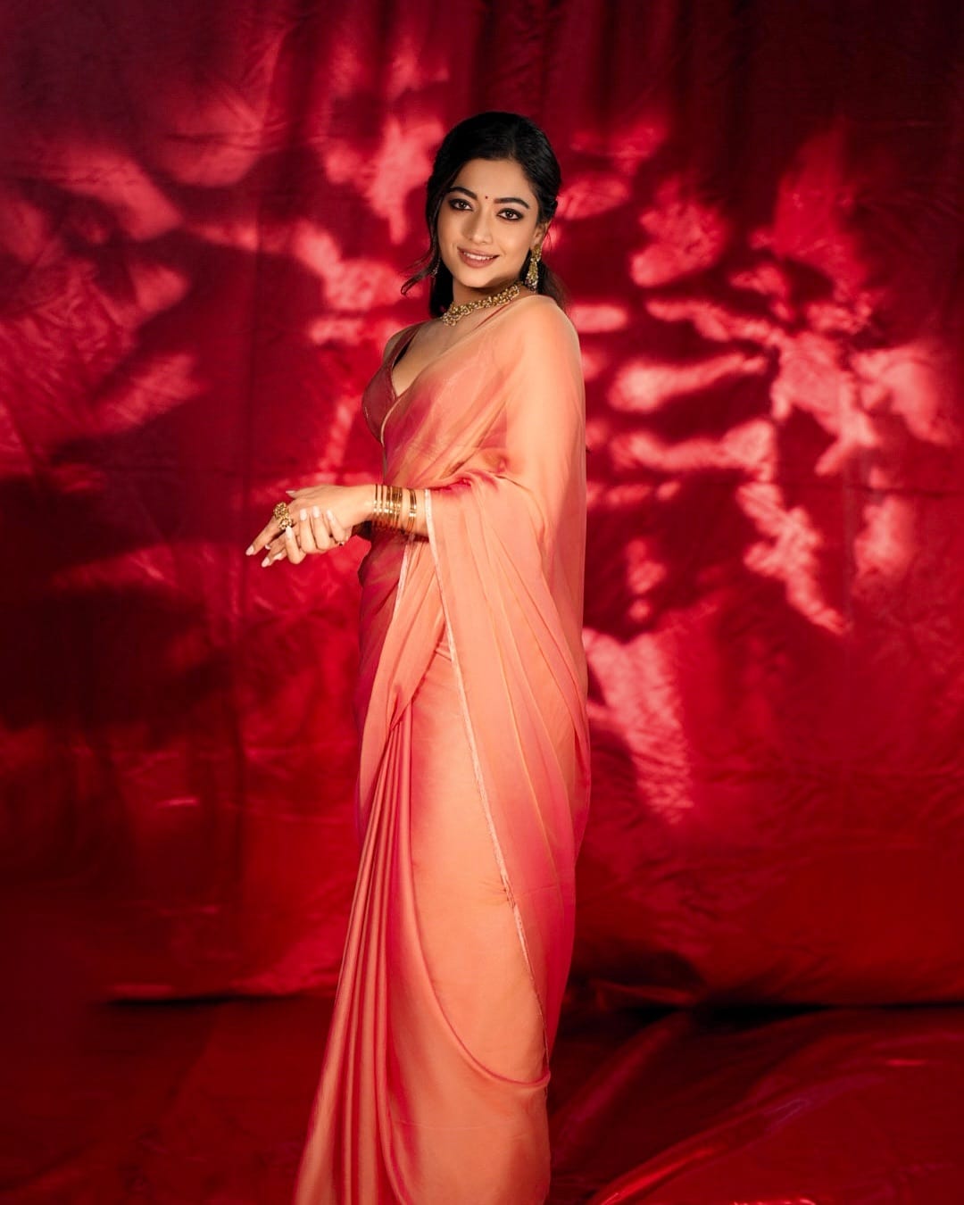 None can beat the charm of a chiffon saree! Wear it in a feminine shade like peach.