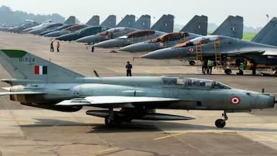 IAF's MiG-21 passes near Sukhoi-30 fighter jets | AFP Image