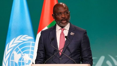 Liberia President George Weah speaks during a plenary session at the COP28 U.N. Climate Summit, Saturday, Dec. 2, 2023, in Dubai, United Arab Emirates. (AP Photo/Rafiq Maqbool, File)

