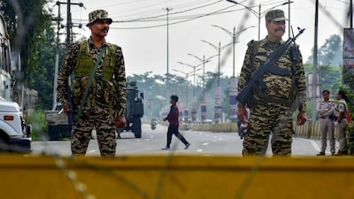 Security personnel stand guard on a road, a day after protests erupted over the arrest of a leader of Meitei outfit Arambai Tenggol, in Manipur's Imphal East district in June. (Image: PTI/File)