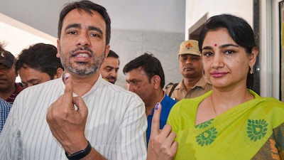 RLD chief Jayant Chaudhary and his wife Charu Singh after casting their vote in the second phase of the Lok Sabha polls in April 2024. (Image: PTI/File)