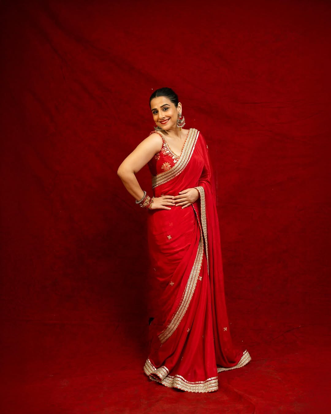 On Day 2, the actor draped a stunning red silk saree with a golden border. She wore it with a floral-embroidered red blouse for a perfect contrast. On Day 2, the actor draped a stunning red silk saree with a golden border. She wore it with a floral-embroidered red blouse for a perfect contrast.