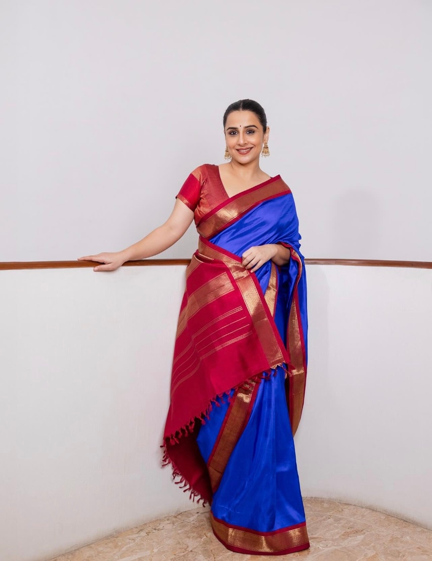Vidya chose a vibrant blue Kanjeevaram silk saree with a maroon and golden border for Day 3, which she wore with a maroon blouse. Vidya chose a vibrant blue Kanjeevaram silk saree with a maroon and golden border for Day 3, which she wore with a maroon blouse.