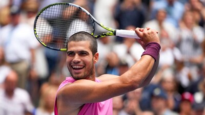 Carlos Alcaraz makes a golf swing with his racket after defeating Jiri Lehecka. (AP Photo)
