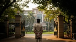 In this AI-generated image, a Bengaluru police officer stands outside the gates of an international school, symbolising law enforcement action following a reported incident.