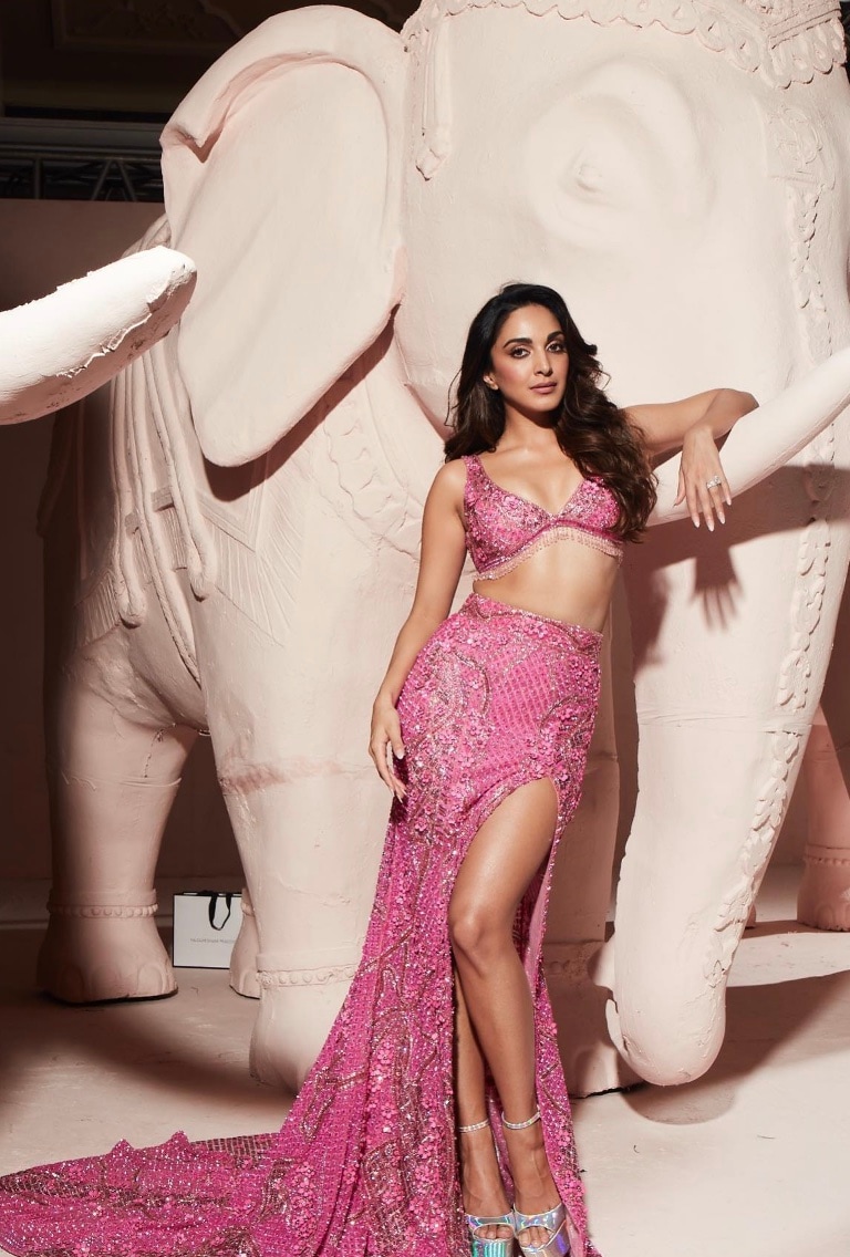 Flaunt your toned frame in a stylish pink lehenga, featuring a thigh-high slit, just like this one worn by Kiara Advani. Flaunt your toned frame in a stylish pink lehenga, featuring a thigh-high slit, just like this one worn by Kiara Advani.
