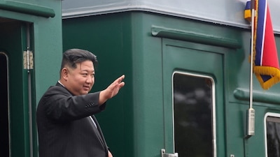 North Korean leader Kim Jong Un waves before boarding his train. (AFP file photo)