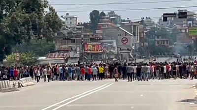Protesters try to enter the Nepali Congress Party office in Balkhu area of the city during a protest, in Kathmandu, Nepal, Tuesday, Sept. 9, 2025. (Image: PTI)
