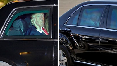 Donald Trump  (left) and Vladimir Putin in their cars. (AP)