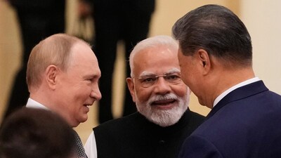 From left to right: Russian President Vladimir Putin, Prime Minister Narendra Modi and Chinese President Xi Jinping. (AP photo) 