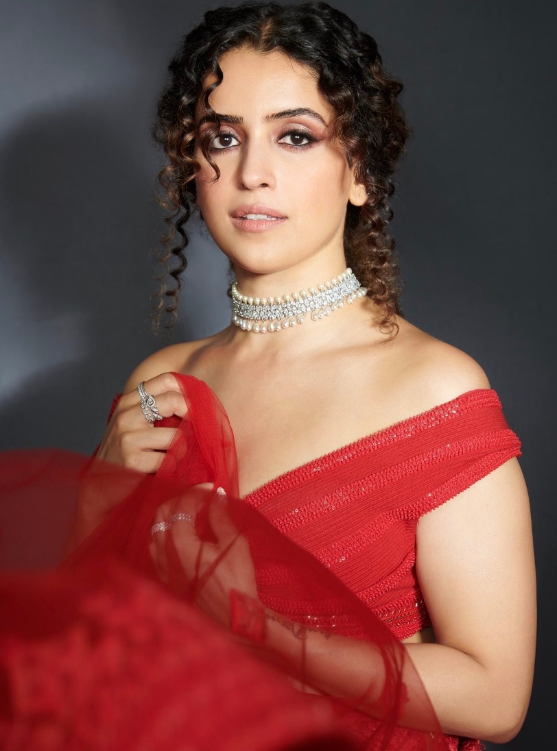 Off-Shoulder Ruffle Blouse: When it comes to playful elegance with a touch of drama, Sanya Malhotra knows exactly how to strike the right balance. Whether you're dressing for a cocktail party, a festive soirée, or a destination wedding, this blouse style is your go-to for making a fashion-forward statement with ease. Off-Shoulder Ruffle Blouse: When it comes to playful elegance with a touch of drama, Sanya Malhotra knows exactly how to strike the right balance. Whether you're dressing for a cocktail party, a festive soirée, or a destination wedding, this blouse style is your go-to for making a fashion-forward statement with ease.