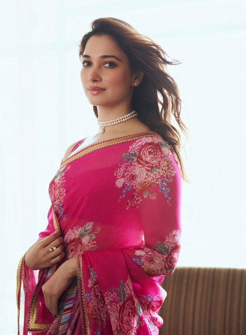 Drape a classic pink chiffon saree with delicate floral prints to bring an end to Navratri this year, inspired by Tamannaah Bhatia. ( Drape a classic pink chiffon saree with delicate floral prints to bring an end to Navratri this year, inspired by Tamannaah Bhatia. (