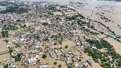 An aerial view of an area inundated with water of the swollen Yamuna river at Vrindavan in Mathura district. (PTI)