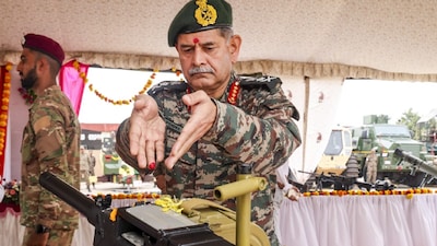 General Upendra Dwivedi performs rituals during the 'Shastra Pooja' on Vijayadashmi, in Bhuj Sector. (IMAGE: PTI) 