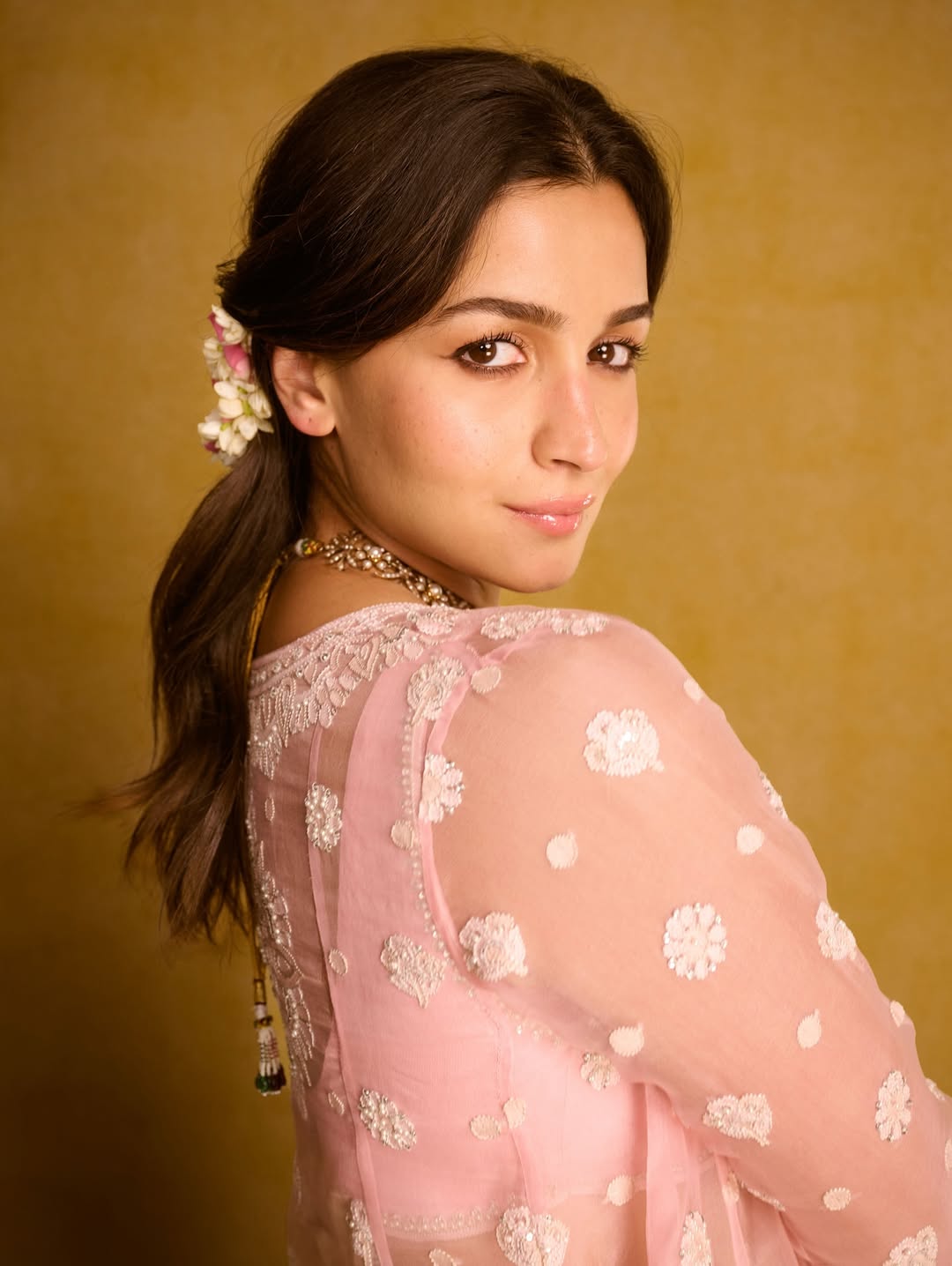 Alia Bhatt: Take inspiration from the actress and style your tresses in a centre parting, securing half locks with gajras. (Image: Instagram) Alia Bhatt: Take inspiration from the actress and style your tresses in a centre parting, securing half locks with gajras. (Image: Instagram)