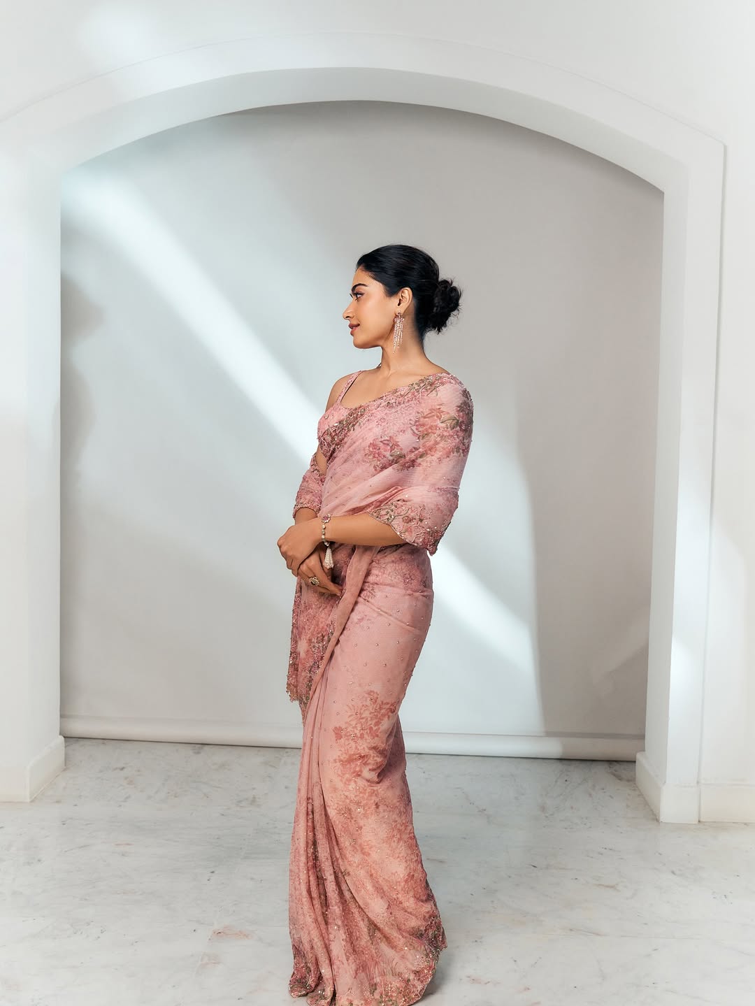 Rashmika Mandanna: Embrace the actress’ carefree charm with a messy bun. Add loose strands and subtle waves for a playful yet graceful festive vibe. (Image: Instagram) Rashmika Mandanna: Embrace the actress’ carefree charm with a messy bun. Add loose strands and subtle waves for a playful yet graceful festive vibe. (Image: Instagram)