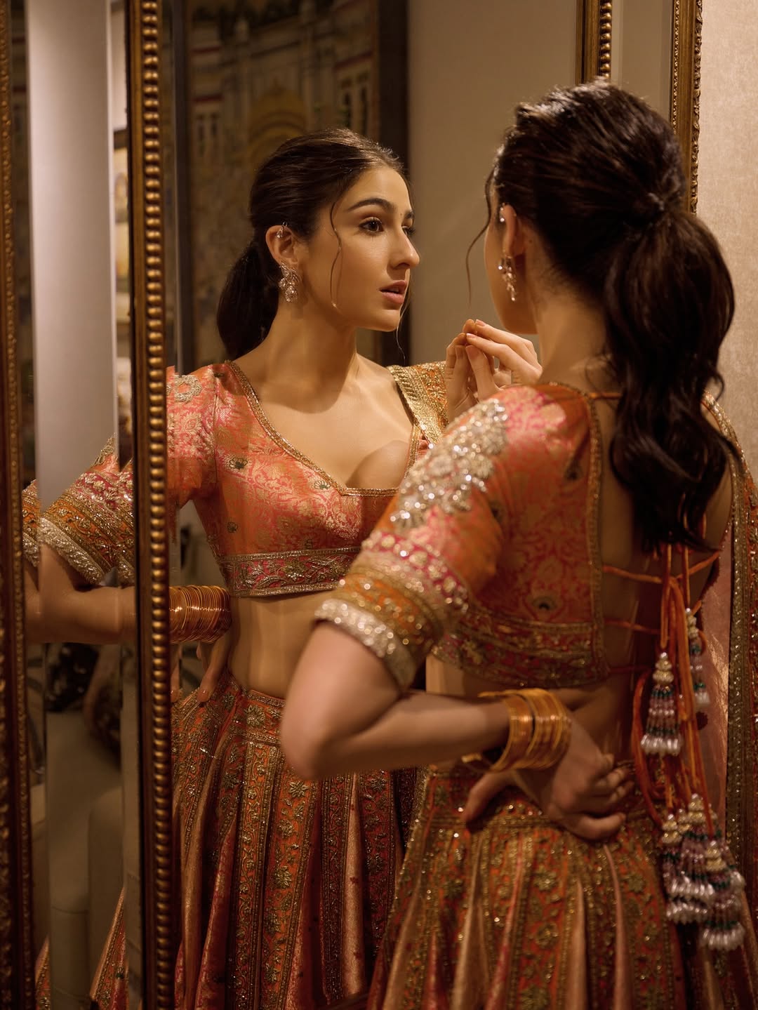 Sara Ali Khan: Get the actress’ chic vibe with a sleek low ponytail. It complements both sarees and lehengas, keeping your festive look modern yet elegant. (Image: Instagram) Sara Ali Khan: Get the actress’ chic vibe with a sleek low ponytail. It complements both sarees and lehengas, keeping your festive look modern yet elegant. (Image: Instagram)