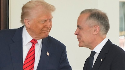 Canadian Prime Minister Mark Carney is greeted by President Donald Trump as he arrives at the West Wing of the White House (Photo/AP)